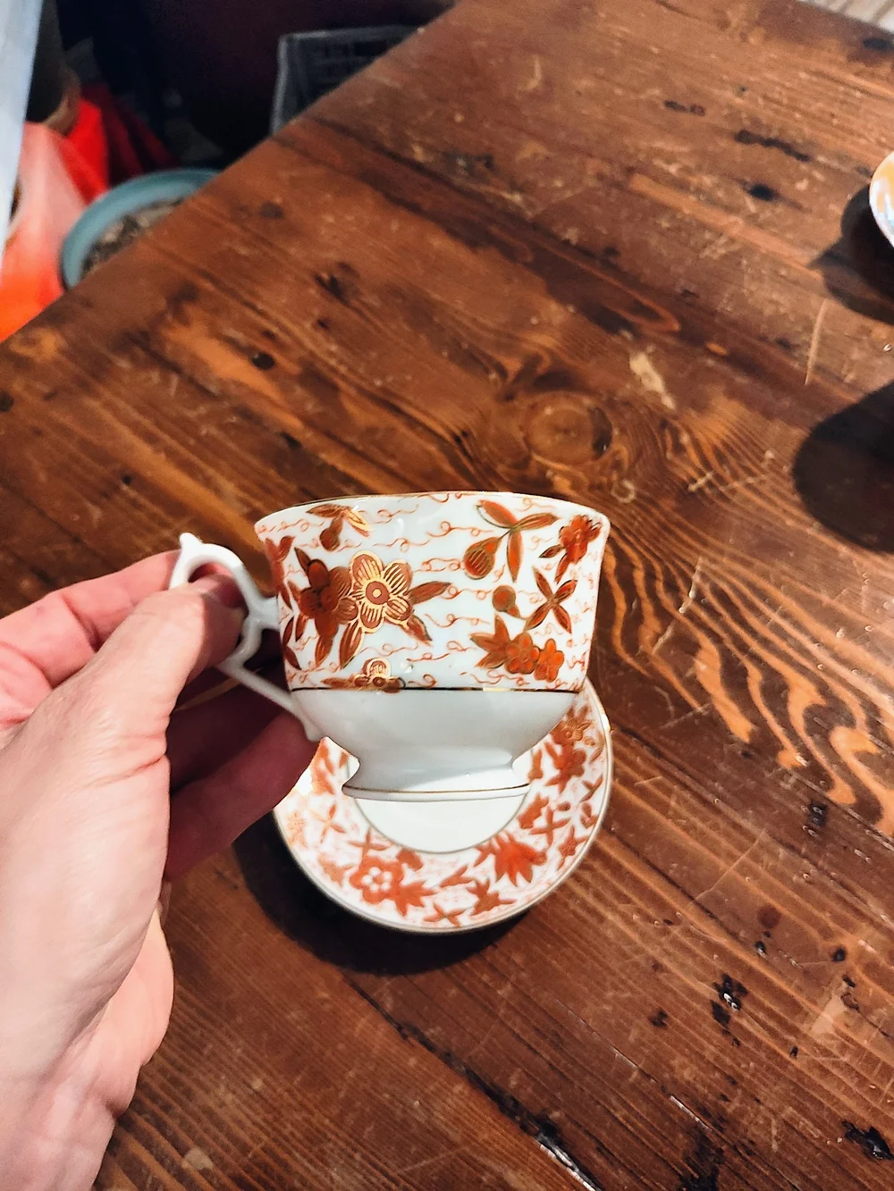 Porcelain Teacup and Saucer - White with Rust Floral Pattern